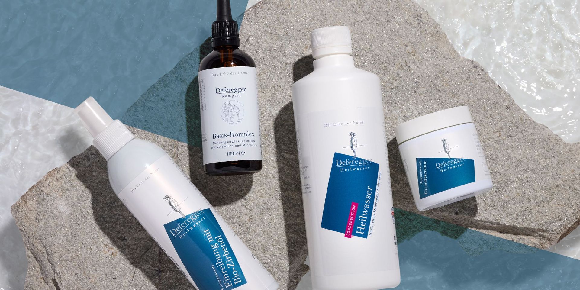 Vier Deferegger Heilwasser Produkte auf Steinuntergrund