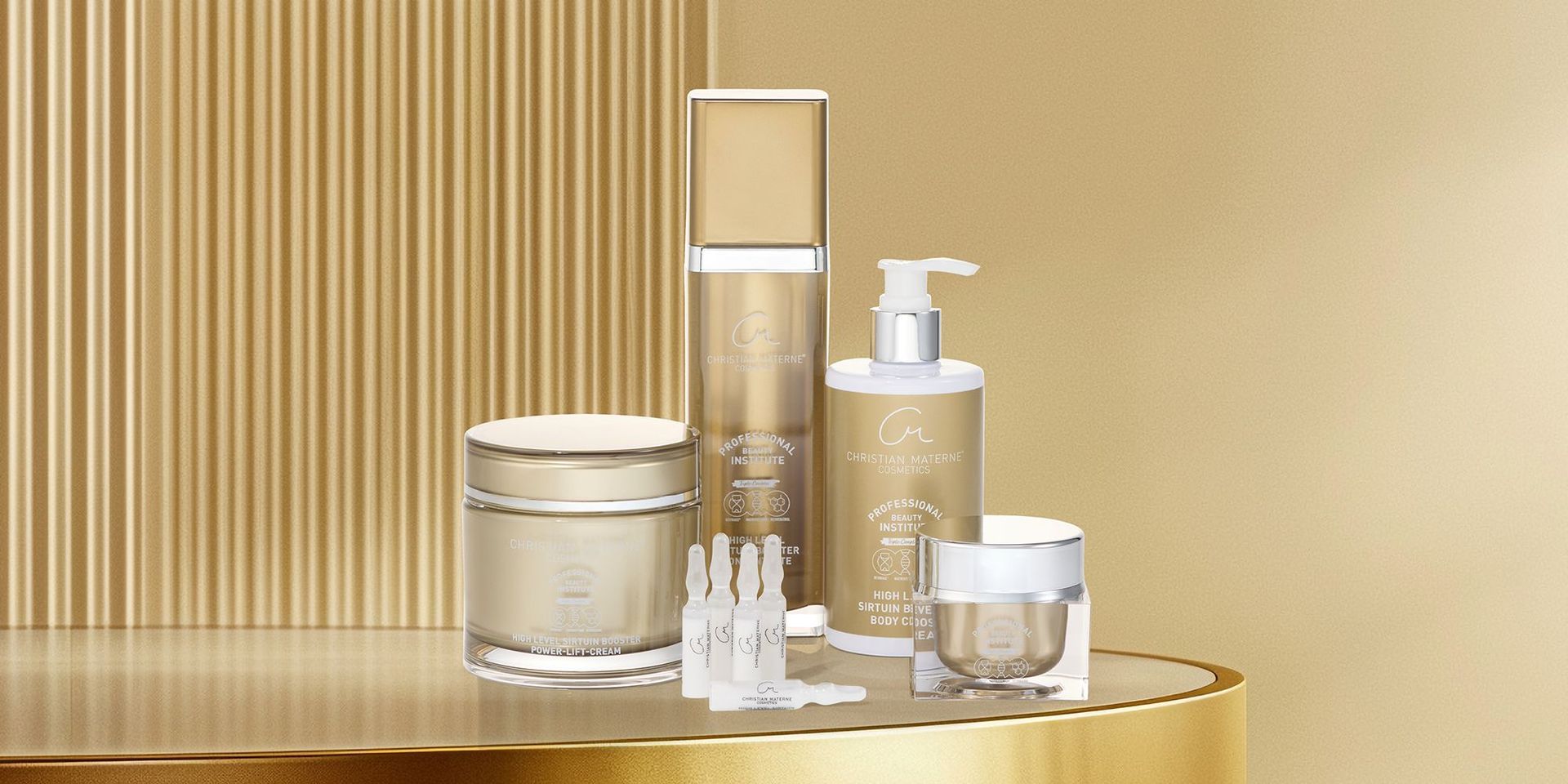 Pflegelinie Sirtuin von Christian Materne Cosmetics mit Creme, Serum, Body Lotion und Ampullen in goldfarbenen Behältern