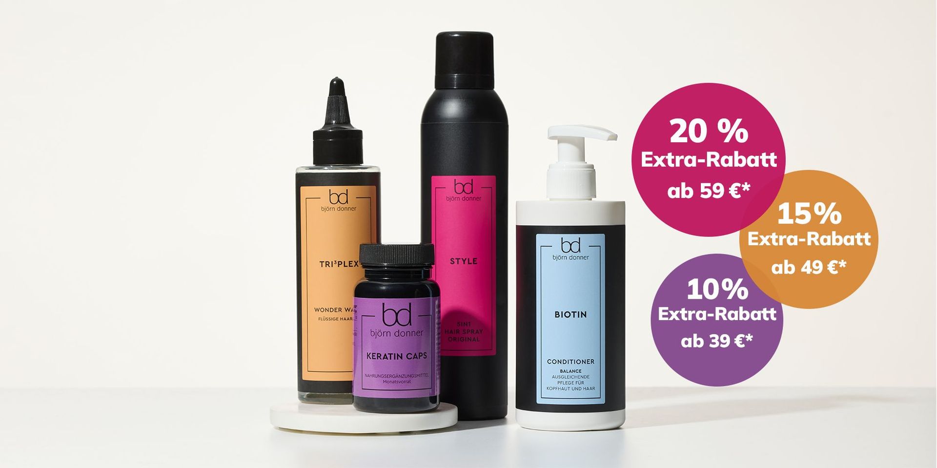 Vier Haarpflegeprodukte von Björn Donner mit farbigen Rabattkreisen über den Flaschen: 20 % ab 59 €, 15 % ab 49 €, 10 % ab 39 €